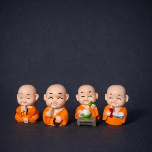 Smiling Monk Showpiece Set of 8 | Mini Buddha Figurines for Home Decor