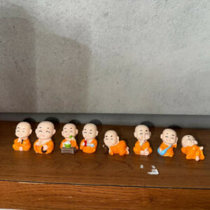 Smiling Monk Showpiece Set of 8 | Mini Buddha Figurines for Home Decor