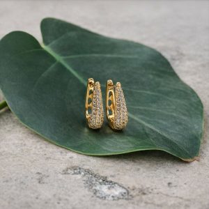 Elegant Curved Pavé Crystal Huggie Earrings in Gold Finish